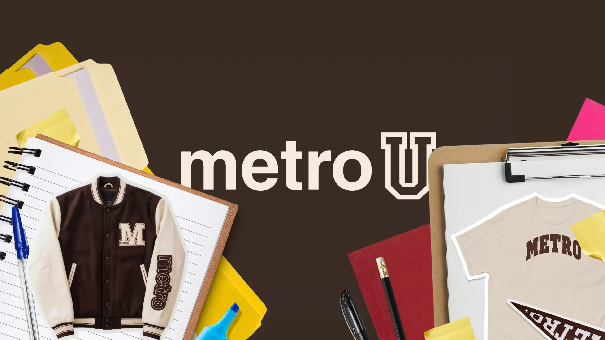 Metro U key visual — the collegiate 'metro U' wordmark among notebooks, pencils, a varsity jacket, and a Metro tee on a brown backdrop.
