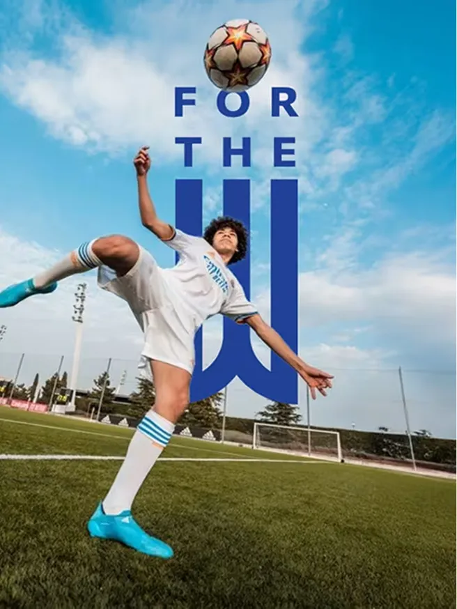 Key visual — a soccer player heading the ball above a large blue W, headline 'For The W'.